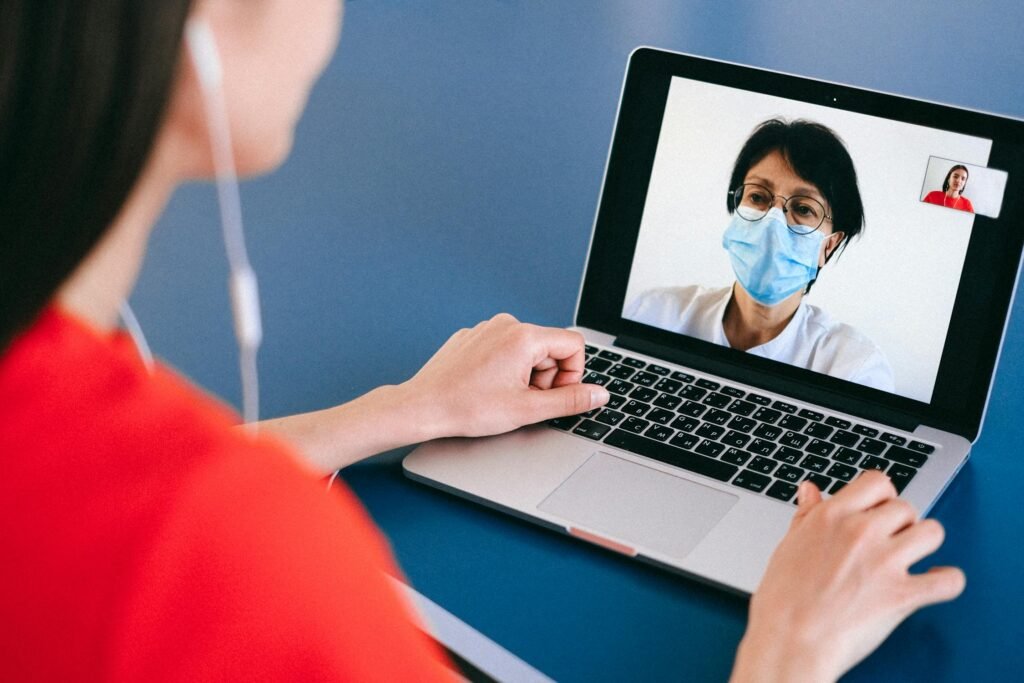 Person on a video call with a healthcare professional
