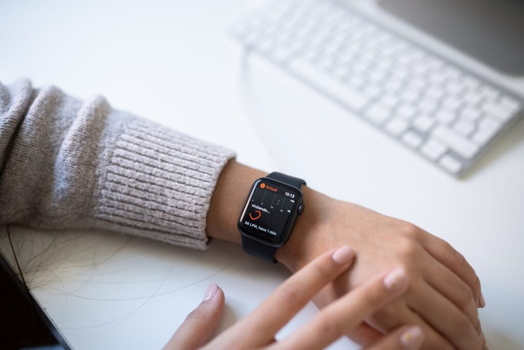 Close-up of a person checking sleep and health data on a smartwatch display.